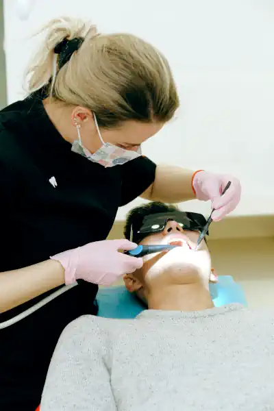 Dentist treating patient